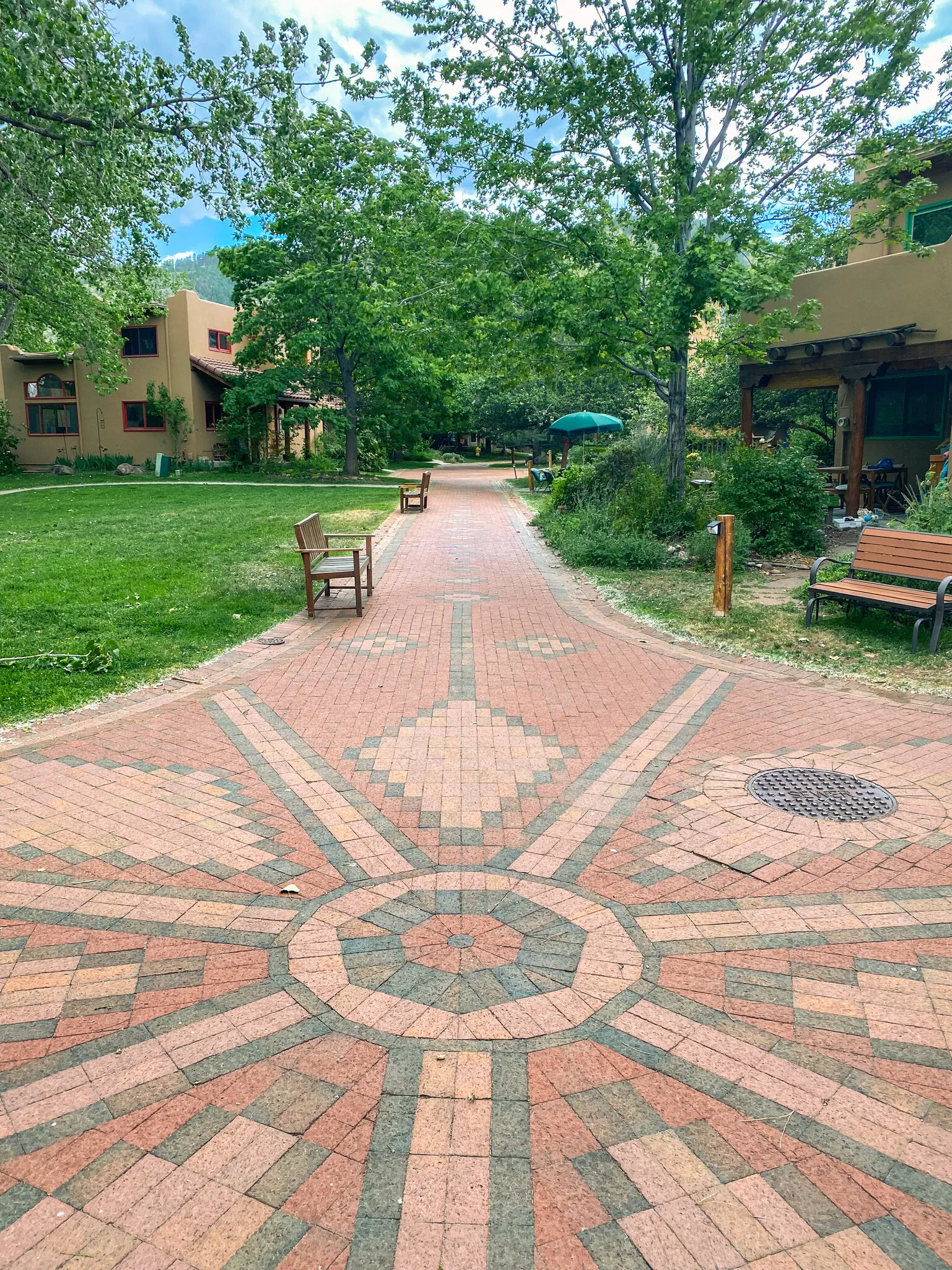 Shaded brick pathway through Harmony Village