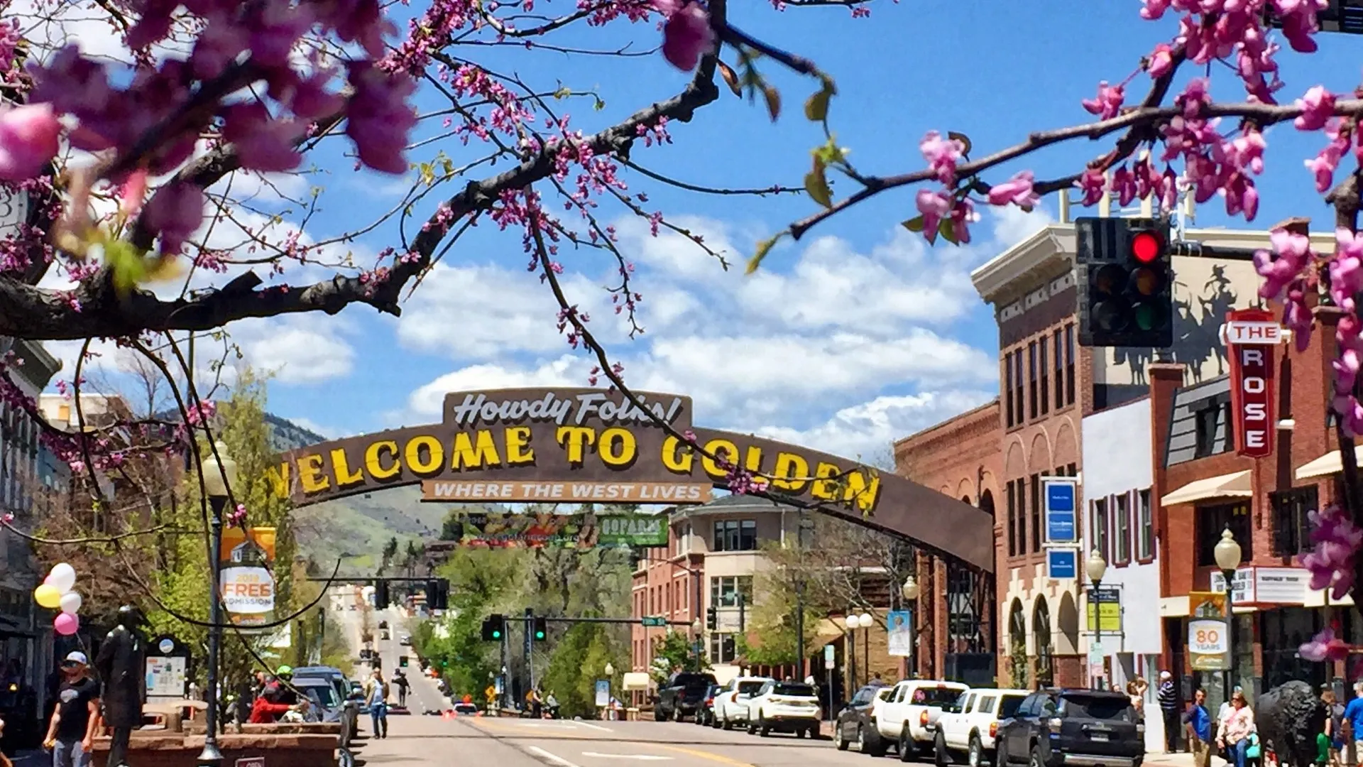 Spring blossoms framing the “Welcome to Golden” arch on Washington Avenue.