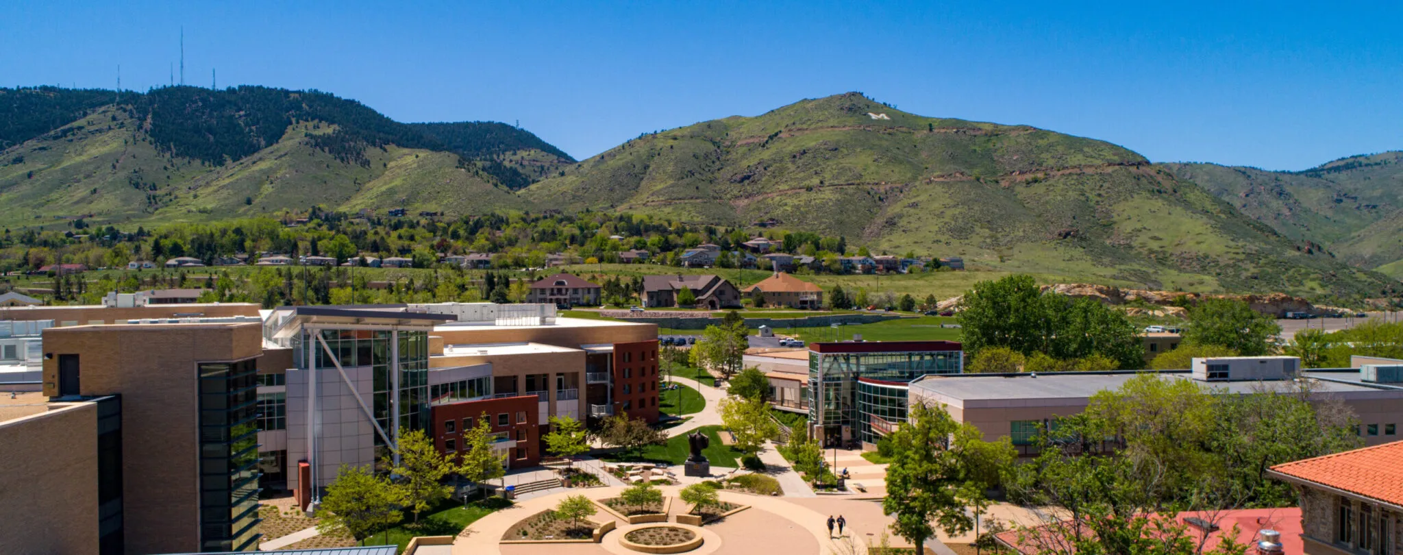 Colorado School of Mines campus framed by Golden’s mesas and pine-covered hills.