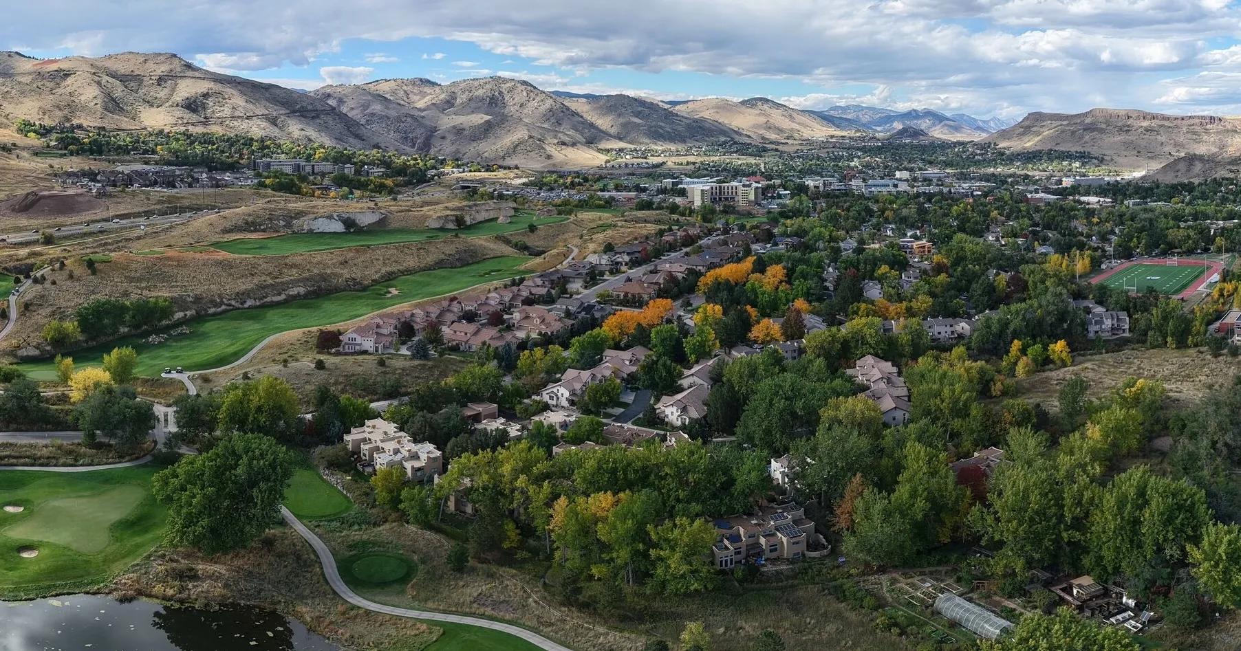 Harmony Village footpaths and homes with the Rocky Mountain foothills in the background