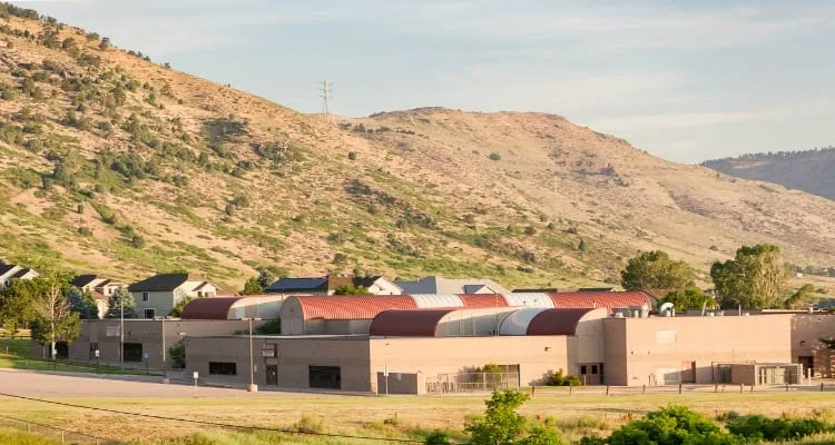 Shelton Elementary’s colorful entry plaza with foothills rising behind the school.