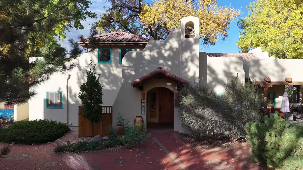 Drone view of Harmony Village community with homes, gardens, and pathways